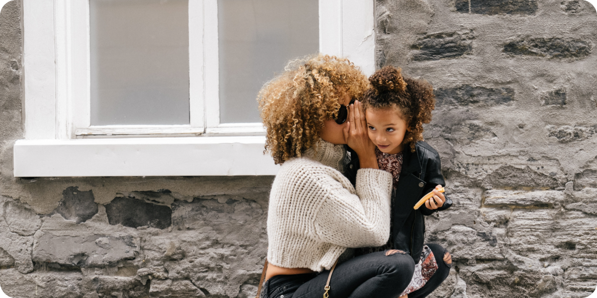 Parent hugging their child outdoors